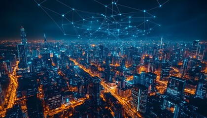 Fototapeta premium Nighttime aerial view of a densely populated city with a glowing network above