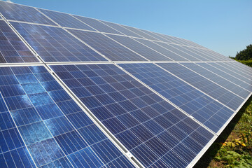 Obraz premium Solar panels are installed on the ground. Photo of solar panels as renewable green energy concept.