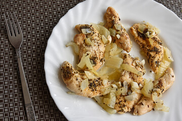 Roasted chicken tenderloins on a plate