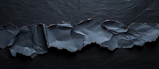 torn paper on a black background copyspace for text isolated