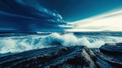 A dramatic seascape showcasing powerful waves crashing against rugged rocks under a moody sky, perfect for nature enthusiasts.