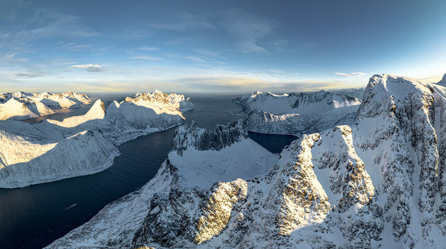 Snowy mountains overlooking a fjord