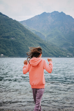 A girl on the lake shore