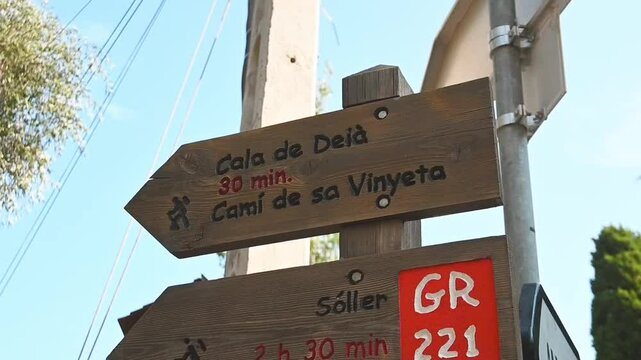 Hiking signs in the village of Deia