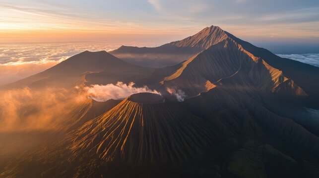 Aerial perspective of the iconic twin volcanoes of Mount Semeru and Mount Bromo, East Java, at sunrise.