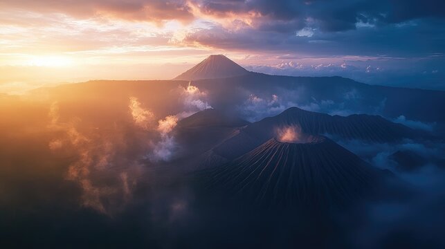 Aerial perspective of the iconic twin volcanoes of Mount Semeru and Mount Bromo, East Java, at sunrise.