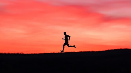 Silhouette of a runner against a stunning sunset background, embodying fitness, freedom, and determination