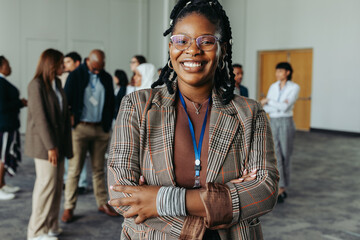 Confident black woman with braids at business conference networking event