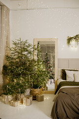 Interior bedrooms in Scandinavian style, decorated for the Christmas holidays. Live ate in the interior.