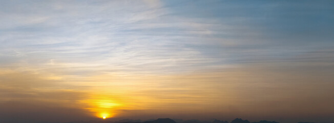 beautiful sunset with a blue sky and a few clouds