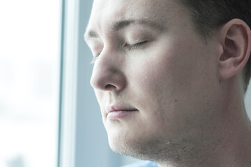 Fototapeta premium A man immersed in sadness, his tears are mute witnesses of internal