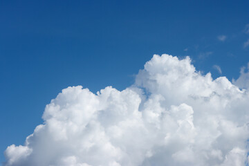 Fototapeta premium White cloud or cloudscape with blues clear sky in sunny day on rain season, weather forecast and climate change concept, copy space for text