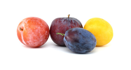 Assorted fresh plums isolated on a white background showcasing vibrant red, blue, yellow, and purple