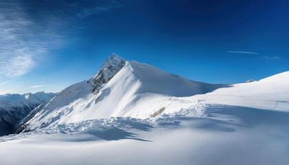 Wide angle view landscape of white snowy peak in mountain range with clear blue sky. Nature concept for lifestyle product background