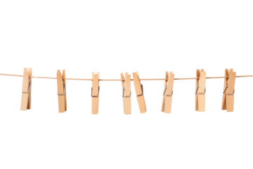 A row of wooden clothespins hanging on a white clothesline, swaying gently in the breeze, isolated on a white background