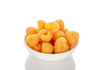 Fresh raspberry berries on a ceramic saucer, macro, isolated on white background.