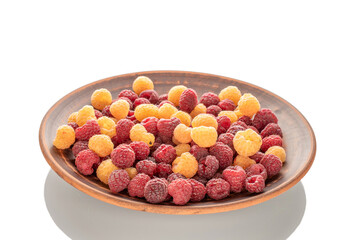 Fresh raspberry berries on a clay plate, macro, isolated on white background.