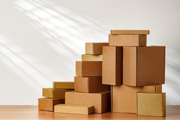 Stacked Cardboard Boxes On Wooden Surface In Sunlight