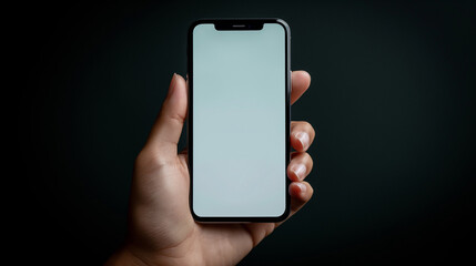 Close-up of a hand holding a smartphone with a blank screen