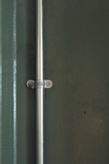 Iron pipe on the green wall