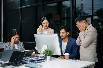 Group of Asian business meeting in planning design in creative business discussing work