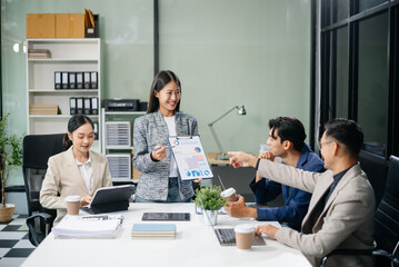 Group of Asian business meeting in planning design in creative business discussing work