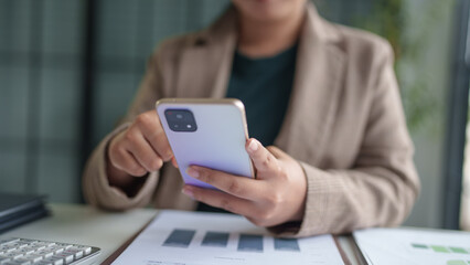 Asian woman using smartphone mobile addict spending time checking news social media cell telephone technology e-commerce concept.