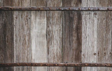 Old wood background texture. Vintage door and metal bar. Old hardwood door gate, .Grunge wood texture, wood wall background.