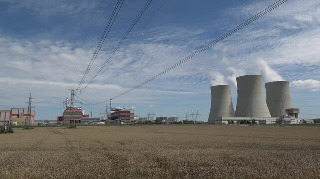 Nuclear power plant Temelin in hot summer weather. South bohemia in Czech republic, European union. Large nuclear power station proucing electricity.
