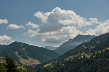 Driving through the high mountains of the Écrins National Park in the French Alps.