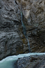 Hiking to the Gletscherschlucht glacier in Grindelwald, with imposing canyons, waterfalls and panoramic views of the valley. Swiss Alps