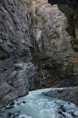 Hiking to the Gletscherschlucht glacier in Grindelwald, with imposing canyons, waterfalls and panoramic views of the valley. Swiss Alps