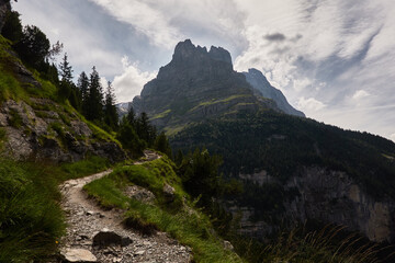 Hiking to the Gletscherschlucht glacier in Grindelwald, with imposing canyons, waterfalls and panoramic views of the valley. Swiss Alps