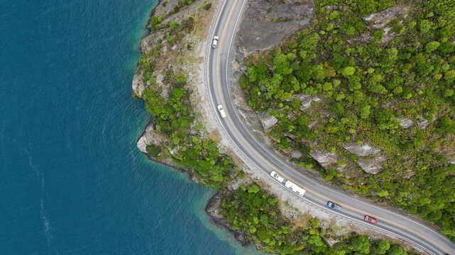 Traffic Along Kingston Road At Devil's Staircase Lookout Point In The Shores of Lake Wakatipu In Otago, New Zealand. Aerial Topdown Shot