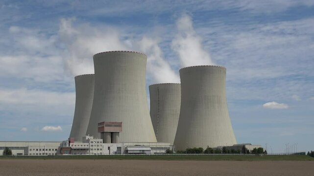 Nuclear power plant Temelin in hot summer weather. South bohemia in Czech republic, European union. Large nuclear power station proucing electricity.