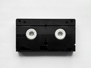 Vintage black vhs cassette tape on white background
