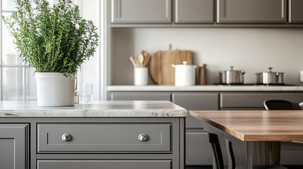 "Front view of an elegant interior featuring gray drawers beneath a kitchen cabinet, an empty wooden table, and a marble countertop. The room includes modern cooking equipment and a well-organized spa