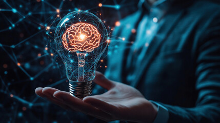 Fototapeta premium Hand holding lightbulb and brain icon for smart technology innovation. Symbolizing creative thinking and innovation in a business. Innovation technology digital. Futuristic technology. Copy space area