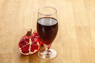 Sweet pomegranate juice in glass