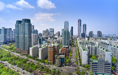 Yeouido, Yeongdeungpo-gu, Seoul, South Korea - April 18, 2021: Aerial view of Saetgang River and high-rise apartments against Park One Tower and financial district in the background