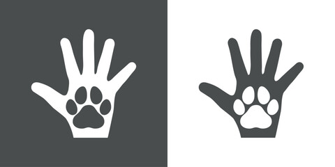 Fototapeta premium Silueta de palma de la mano humana con pata de perro o gato