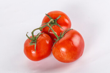 Sweet ripe tomatoes on the branch