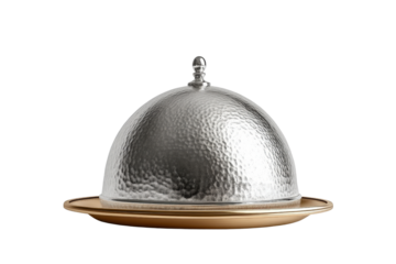 Elegant silver serving dome on a golden plate, perfect for showcasing gourmet dishes in a restaurant or home setting.