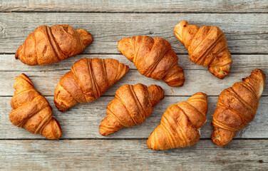 Group of sweet croissant . French morning breakfast . Top view