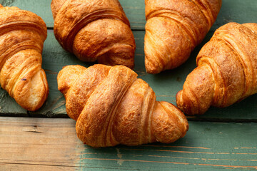 Group of sweet croissant . French morning breakfast . Top view