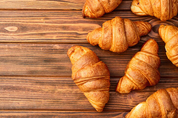 Group of sweet croissant . French morning breakfast . Top view