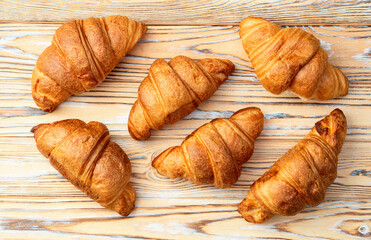 Group of sweet croissant . French morning breakfast . Top view