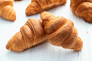Group of sweet croissant . French morning breakfast . Top view