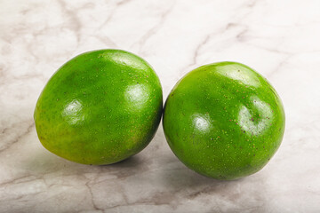 Two ripe green exotic avocado fruit