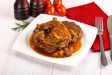 Italian cuisine - ossobuco with sauce